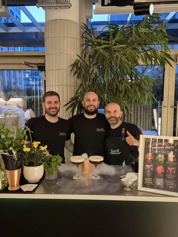 The Salute team of Italian bartenders behind the bar at an event