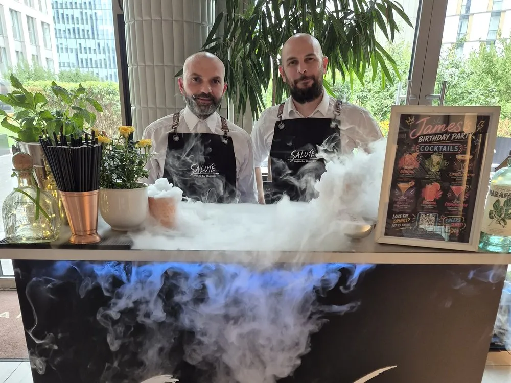 Giacomo and Michele behind the branded Salute mobile bar with a dry-ice effect